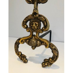 Pair of Neoclassical Bronze and Wrought Iron Andirons with Lion Mascarons. France. Circa 1940.