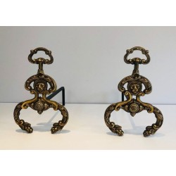 Pair of Neoclassical Bronze and Wrought Iron Andirons with Lion Mascarons. France. Circa 1940.
