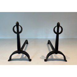 Pair of Wrought Iron Andirons in the style of Jacques Adnet