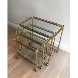 Set of Three Neoclassical Brass Nesting Tables on Casters, Attributed to Maison Baguès
