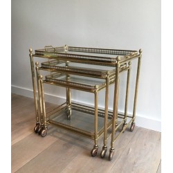 Set of Three Neoclassical Brass Nesting Tables on Casters, Attributed to Maison Baguès