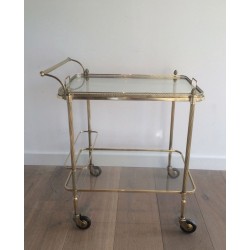 Neoclassical brass drinks trolley by Maison Bagués. Circa 1940