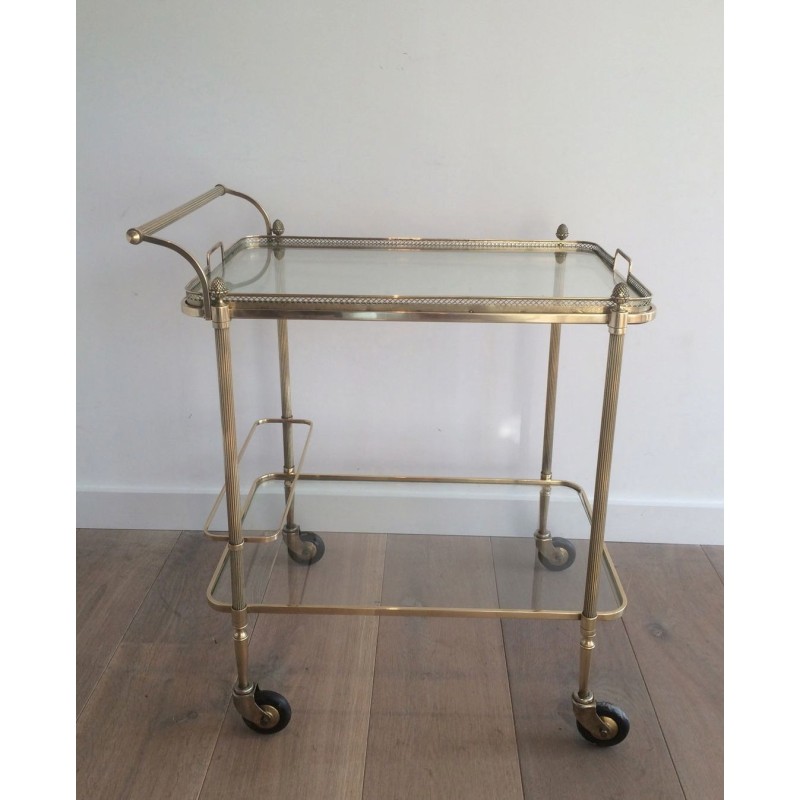 Neoclassical brass drinks trolley by Maison Bagués. Circa 1940