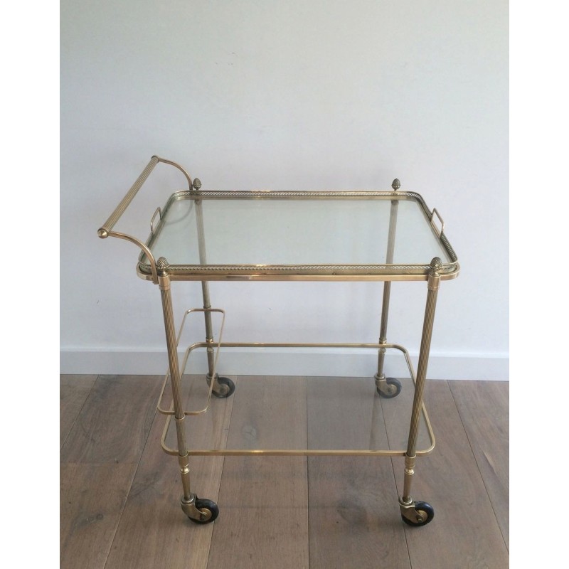 Neoclassical brass drinks trolley by Maison Bagués. Circa 1940