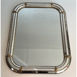 Multi-facets mirror rounded on the corners with brass garlands