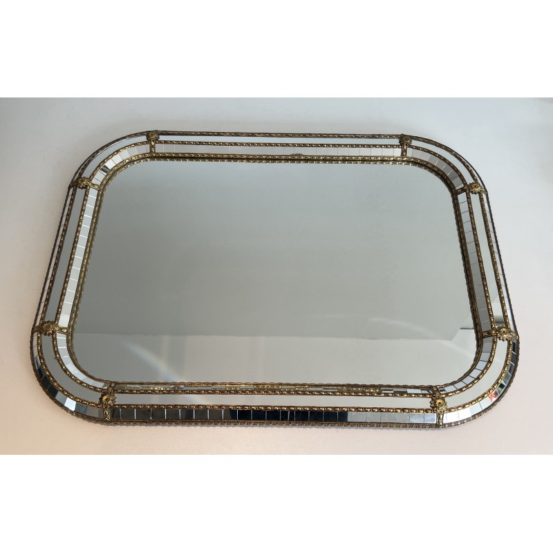 Multi-facets mirror rounded on the corners with brass garlands