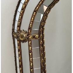 Multi-facets mirror rounded on the corners with brass garlands