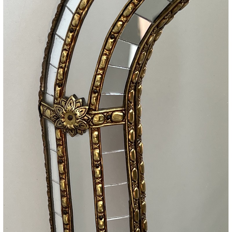 Multi-facets mirror rounded on the corners with brass garlands