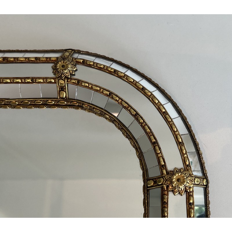 Multi-facets mirror rounded on the corners with brass garlands