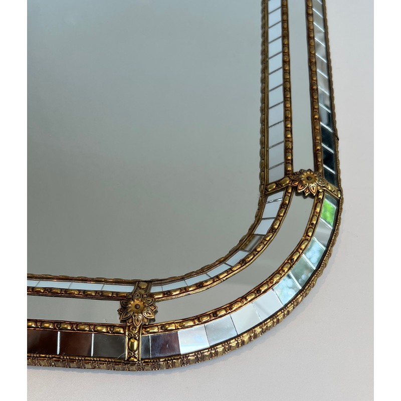 Multi-facets mirror rounded on the corners with brass garlands