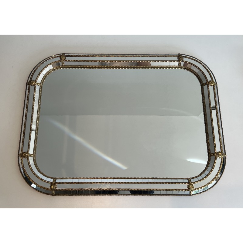 Multi-facets mirror rounded on the corners with brass garlands