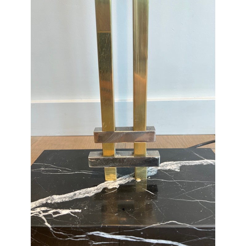 Steel and Brass Floor Lamp, standing on a Black Marble Base. In the Style of Perzel Workshops.