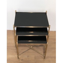 Set of Three Neoclassical Brass Nesting Tables with Black Lacquered Glass Tops by Maison Jansen, Circa 1940