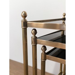 Set of Three Neoclassical Brass Nesting Tables with Black Lacquered Glass Tops by Maison Jansen, Circa 1940
