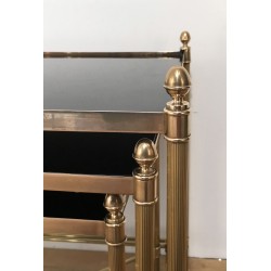 Set of Three Neoclassical Brass Nesting Tables with Black Lacquered Glass Tops by Maison Jansen, Circa 1940