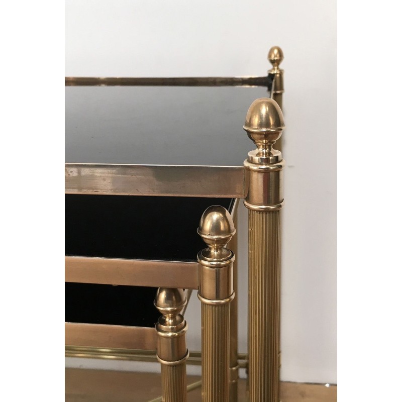Set of Three Neoclassical Brass Nesting Tables with Black Lacquered Glass Tops by Maison Jansen, Circa 1940