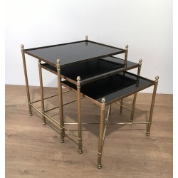 Set of Three Neoclassical Brass Nesting Tables with Black Lacquered Glass Tops by Maison Jansen, Circa 1940