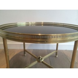 Neoclassical Round Brass Coffee Table with Black Lacquered Glass Top, Maison Baguès, Circa 1940