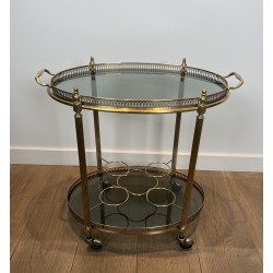 Table Roulante Ovale en Laiton à Plateaux de Verre Bleutés de la Maison Jansen