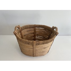 Panier à bûches en rotin, corde et bois, de tradition artisanale française.