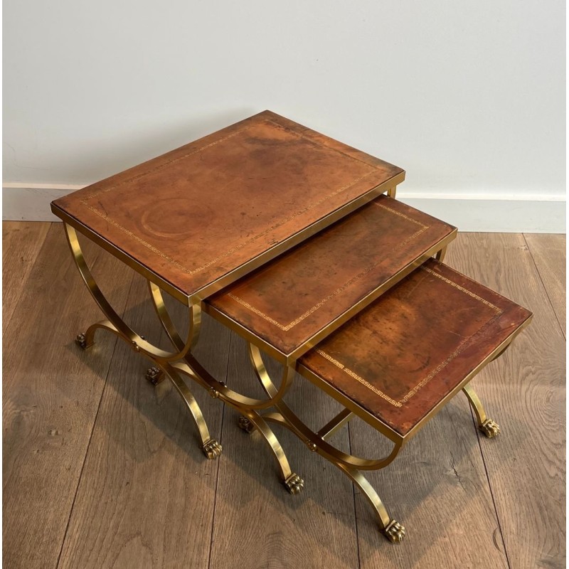 Gilt Metal Nesting Tables with Claw Feet and Leather Tops, Attrib. Maison Jansen, circa 1940