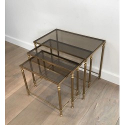 Set of Three Neoclassical Gilt Brass & Smoked Glass Nesting Tables, France circa 1940