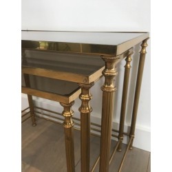 Suite de Trois Tables Gigognes Néoclassiques en Laiton Doré et Verre Fumé, circa 1940