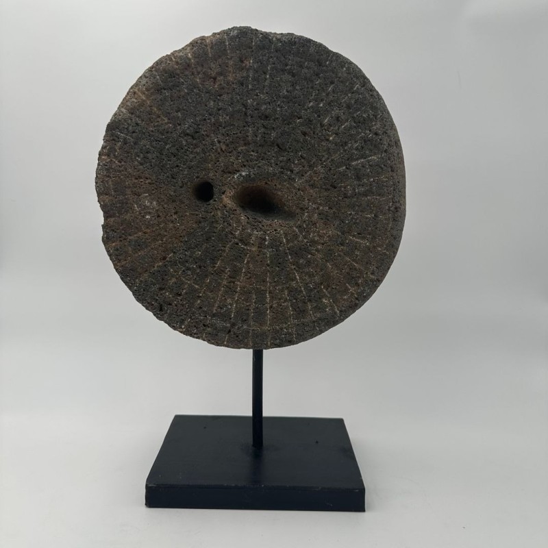 Antique Millstone Mounted as a Decorative Object on a Black Steel Stand