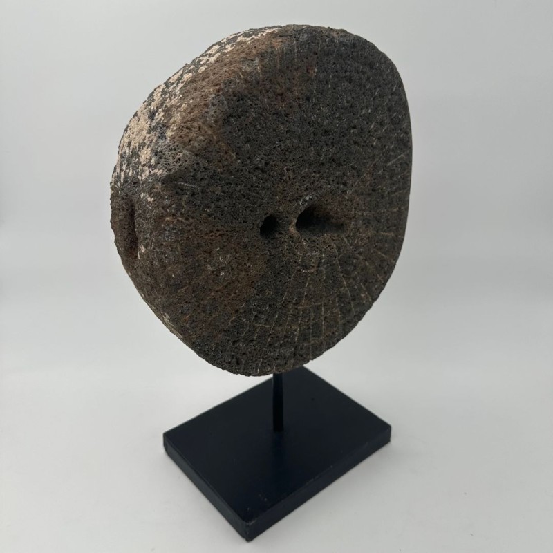 Antique Millstone Mounted as a Decorative Object on a Black Steel Stand