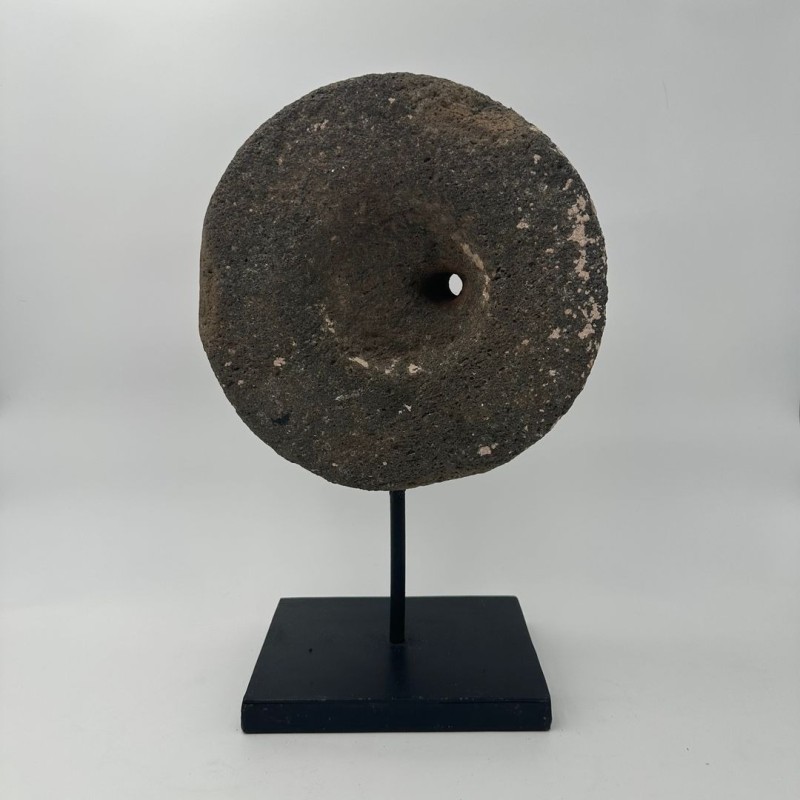 Antique Millstone Mounted as a Decorative Object on a Black Steel Stand