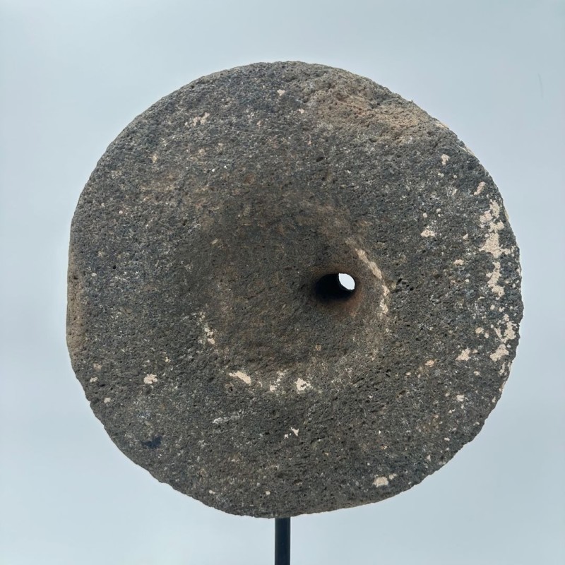 Antique Millstone Mounted as a Decorative Object on a Black Steel Stand