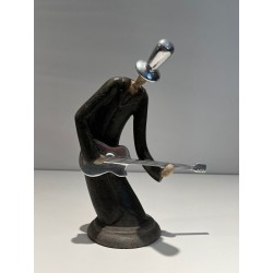 Stylised Sculpture of a Guitar Player in a Cloak, French Work, circa 1970
