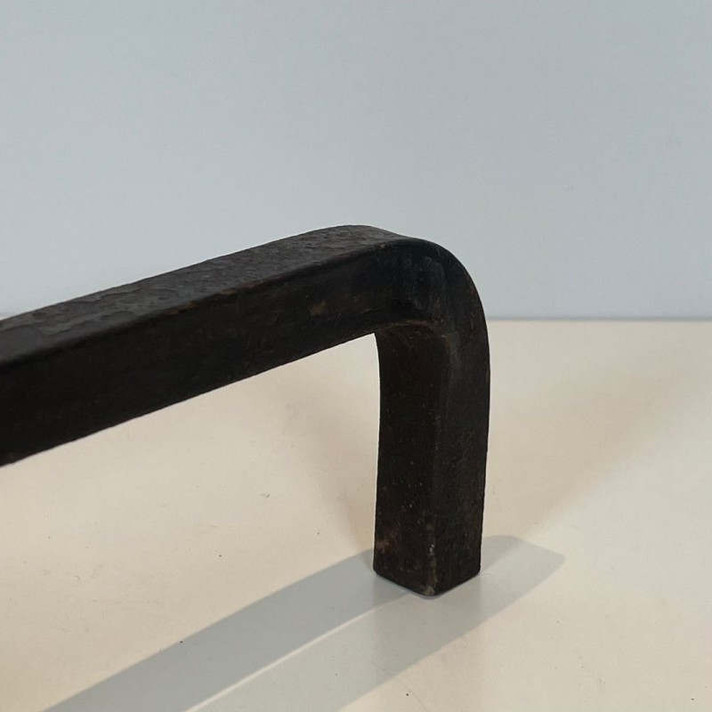 Pair of Modernist Steel and Brass Ball Finial Andirons by Jacques Adnet, French circa 1940